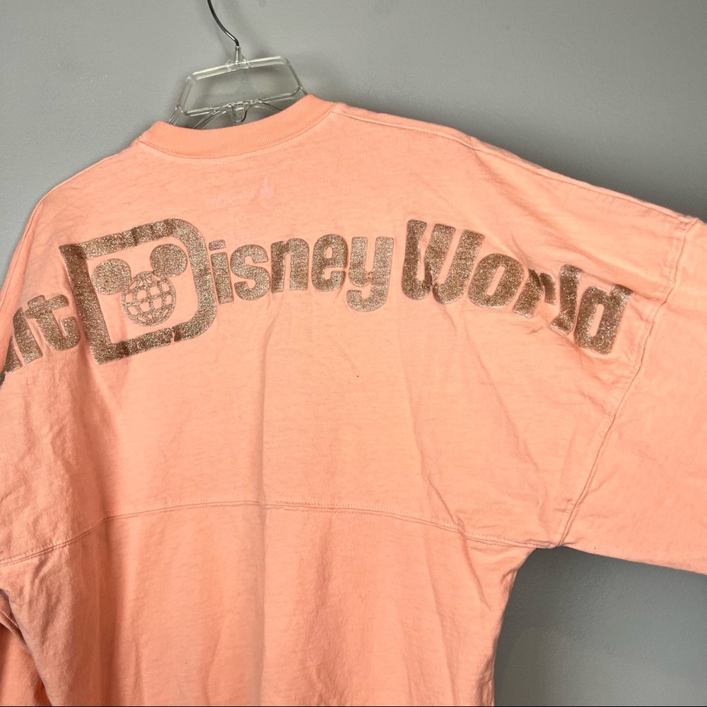 Walt Disney World Spirit Jersey Shirt Pullover Size XS Peach Pink Gold Letters